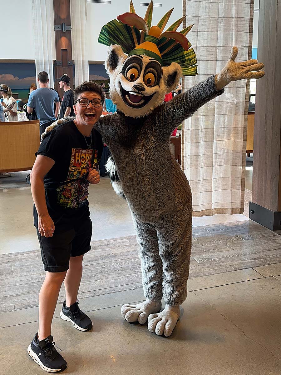 Cora meeting King Julian in Sapphire Falls OnSite Hotel at character meet and greet.