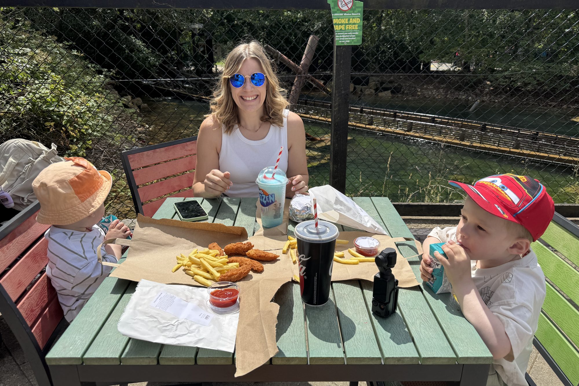 Cora, Helen, and the kids eating at Pirate's Burger Kitchen in Pirate Shores, Legoland Windsor, July 2026
