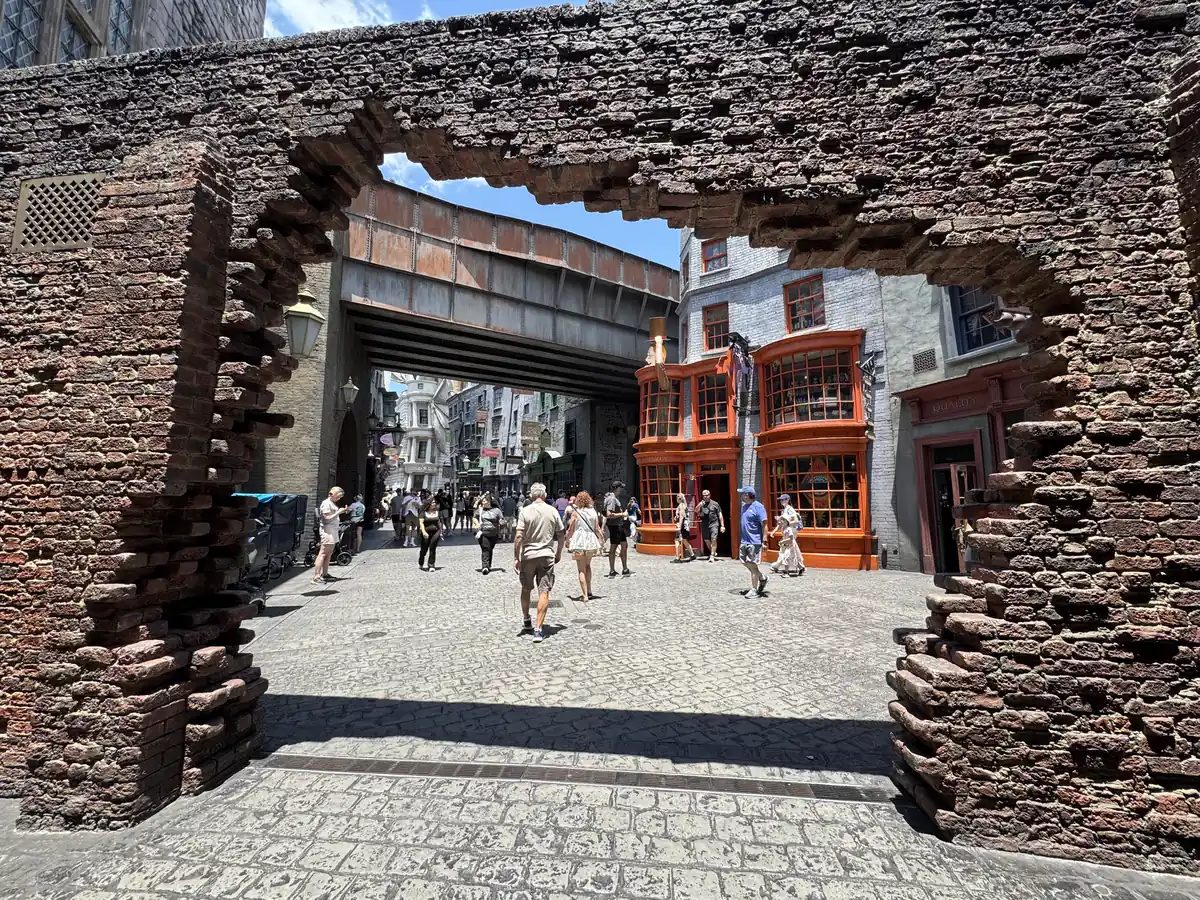 Brick wall entrance from London into Diagon Alley with Weasleys' Wizard Wheezes visible at the Wizarding World of Harry Potter Universal Studios Florida.
