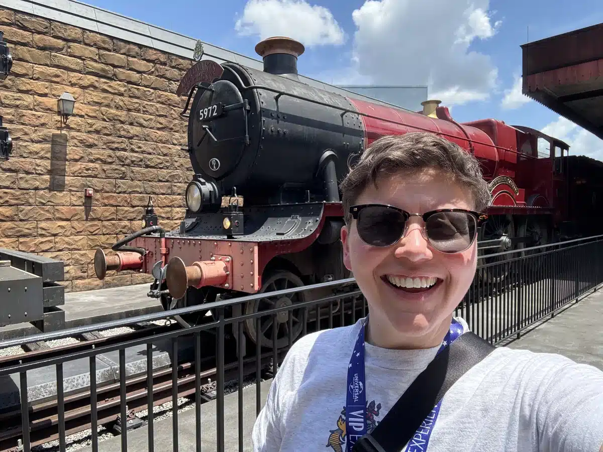 Cora at Hogsmeade Station with Hogwarts Express engine 5972 in the Wizarding World of Harry Potter at Islands of Adventure.