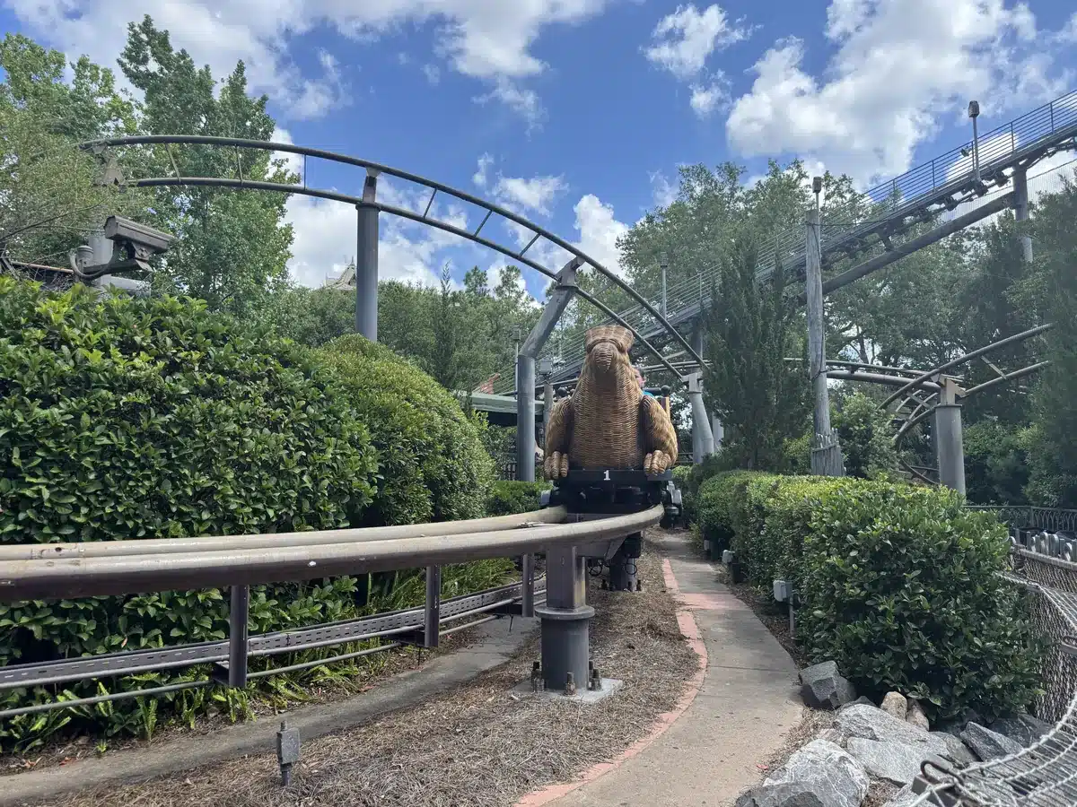 Flight of the Hippogriff coaster track with Buckbeak statue at Hogsmeade in the Wizarding World of Harry Potter at Islands of Adventure.
