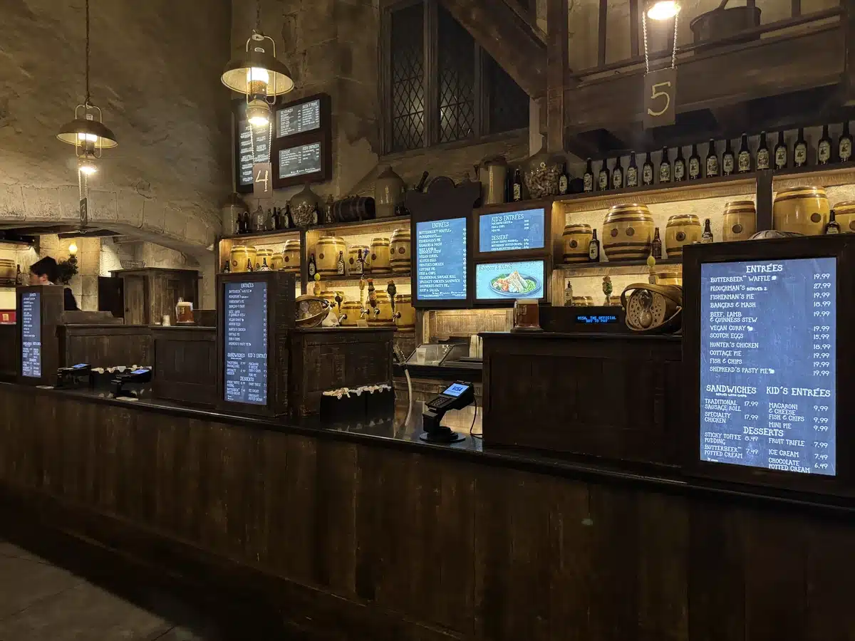 Inside the Leaky Cauldron with menu boards visible at Diagon Alley in the Wizarding World of Harry Potter at Universal Studios Florida.