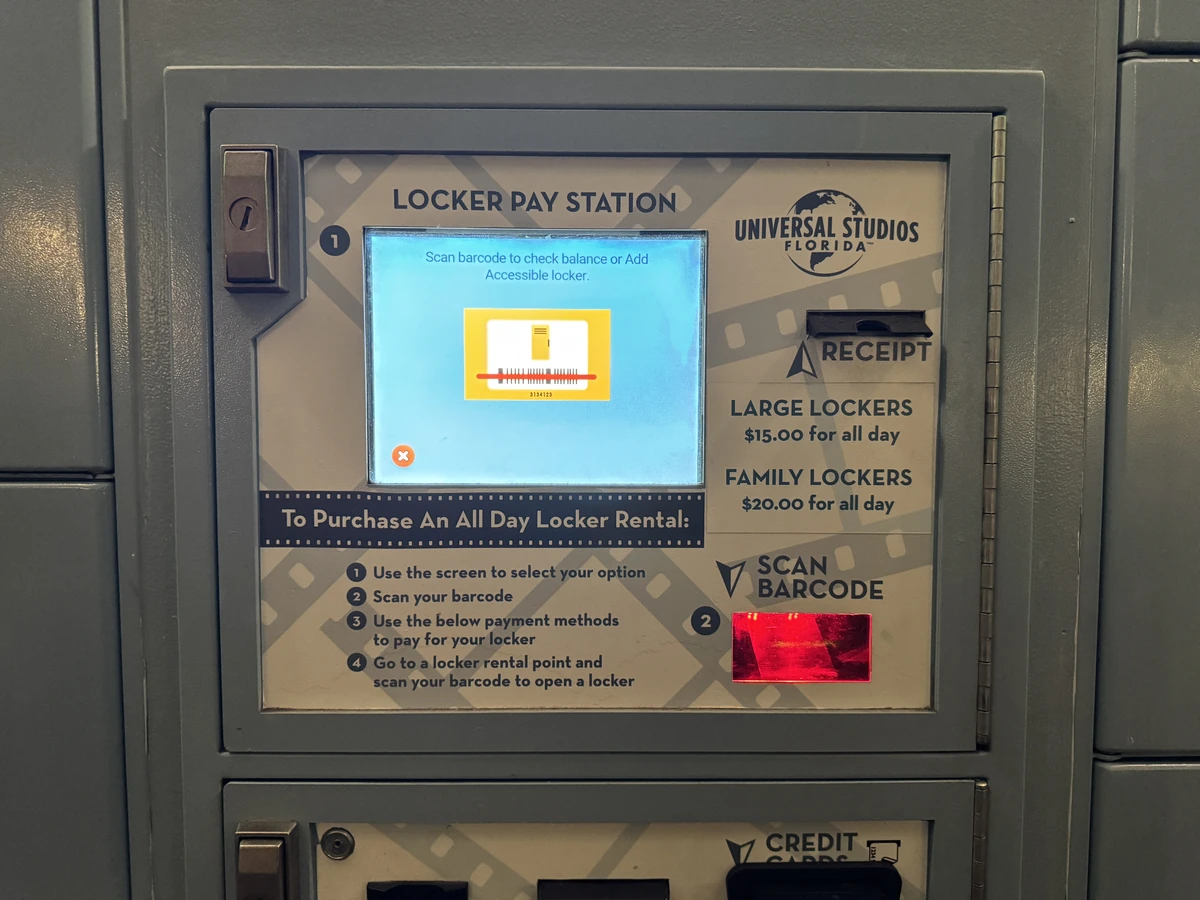 Locker Pay Station at Universal Studios Florida showing $15 large and $20 family all-day locker rental pricing