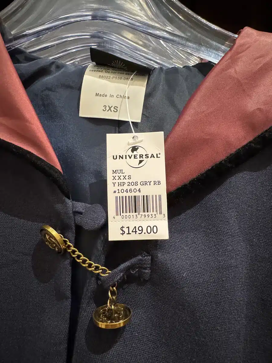 Hogwarts robe price tag showing 149 dollars at Les Galeries Mirifiques Wizarding World of Harry Potter Epic Universe Universal Orlando.