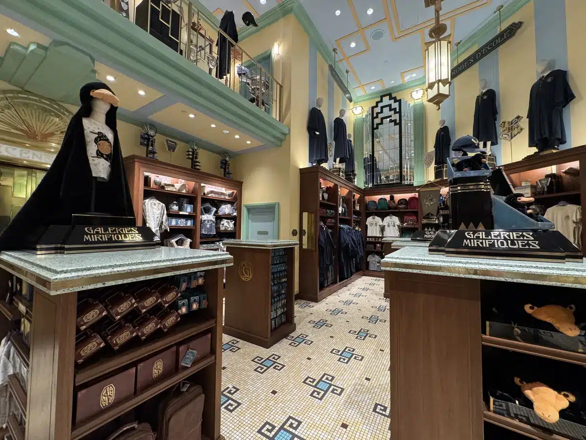 Les Galeries Mirifiques shop interior with Art Deco styling at Place Cachée Wizarding World of Harry Potter Epic Universe.