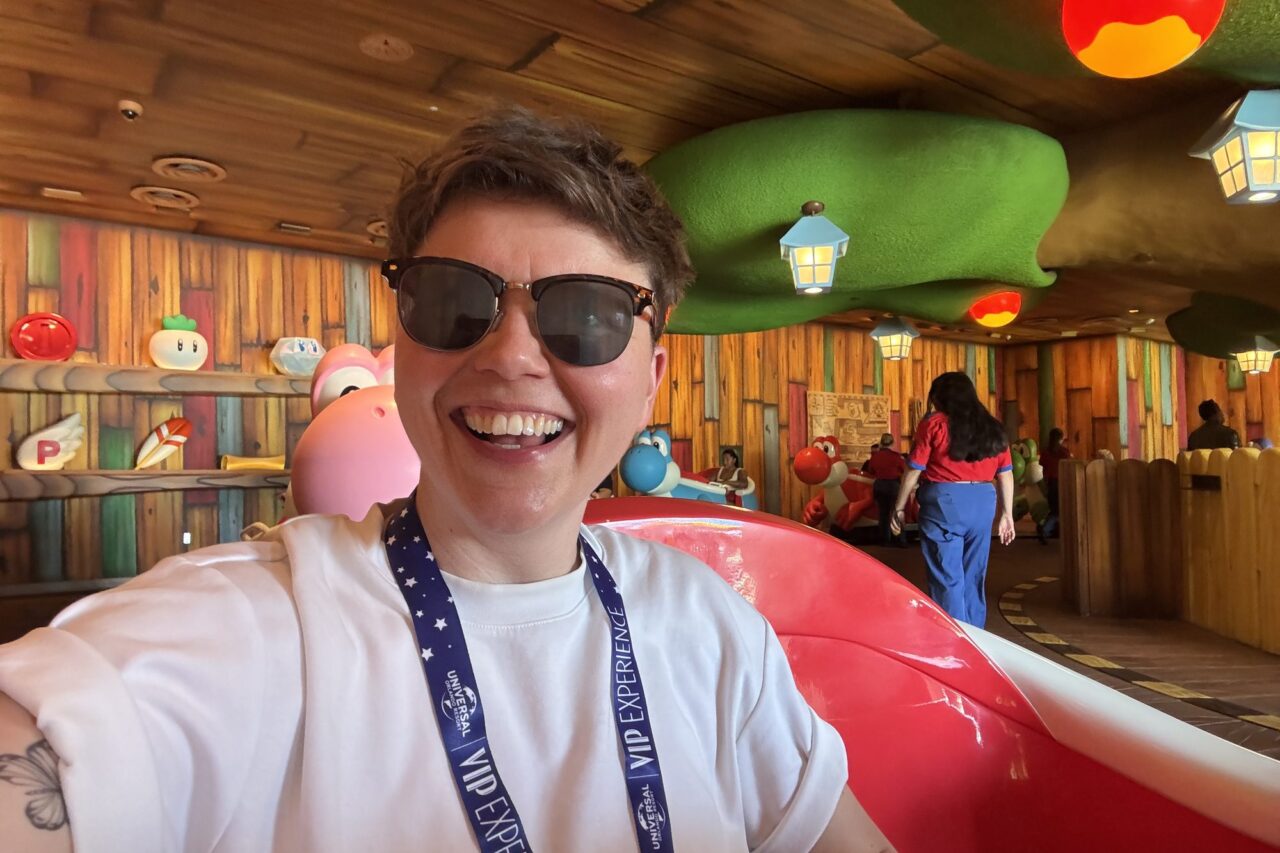 Cora riding Yoshi's Adventure at Super Nintendo World in Epic Universe