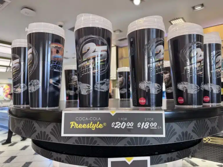Fast & Furious 25th anniversary Coca-Cola Freestyle refillable cups on a display stand with the $20 price sign at Universal Studios Hollywood