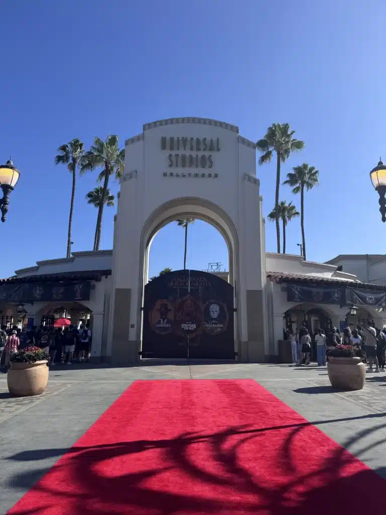 Universal Studios Hollywood entrance arch with the red carpet laid out on the morning of 2 September 2026
