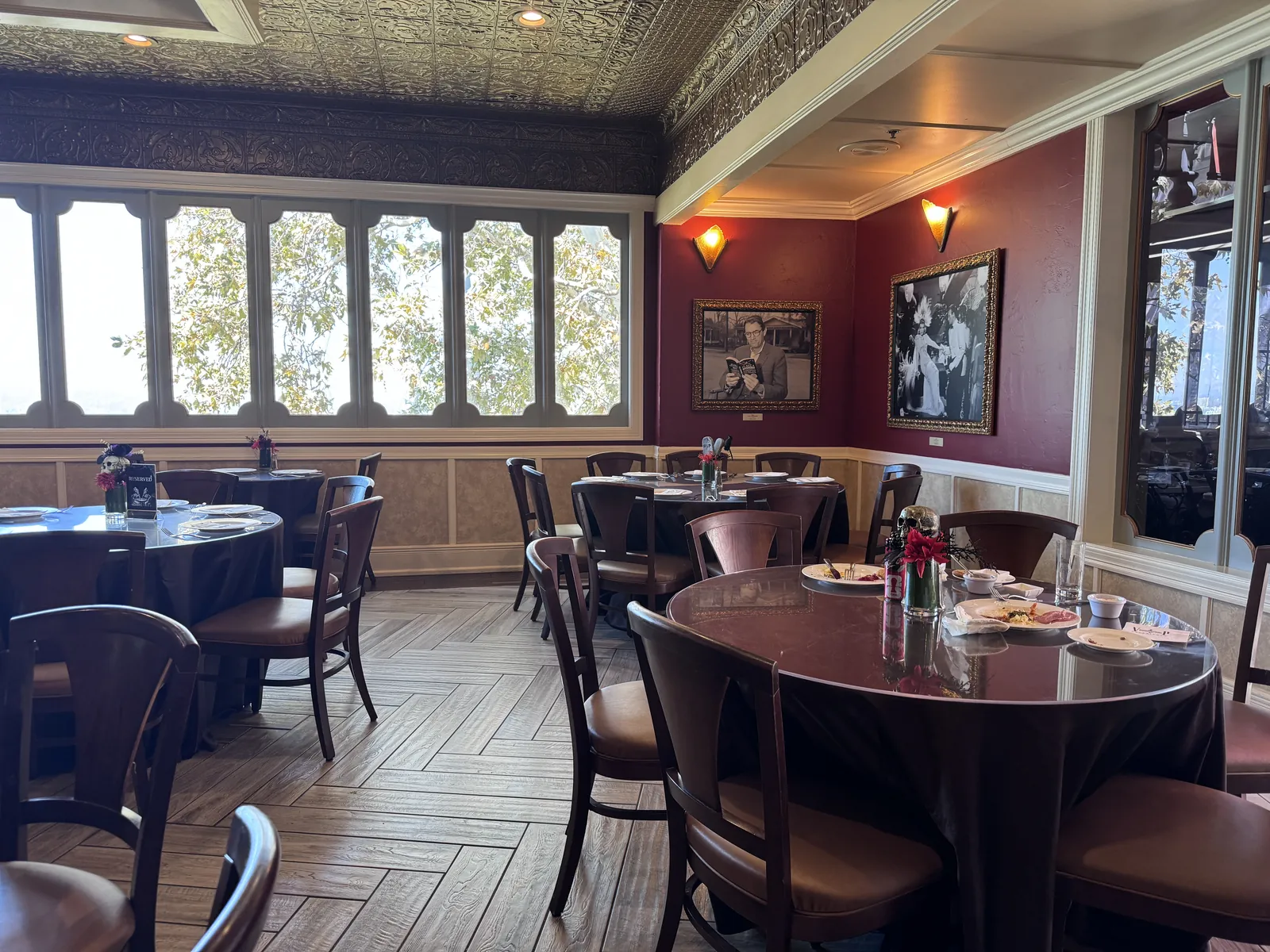 The private VIP Experience dining room at Universal Studios Hollywood with round tables set for lunch